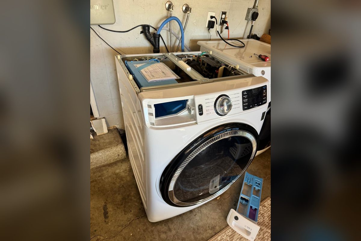 GE front-load washer opened up for repair by Appliance Repair Indio, CA